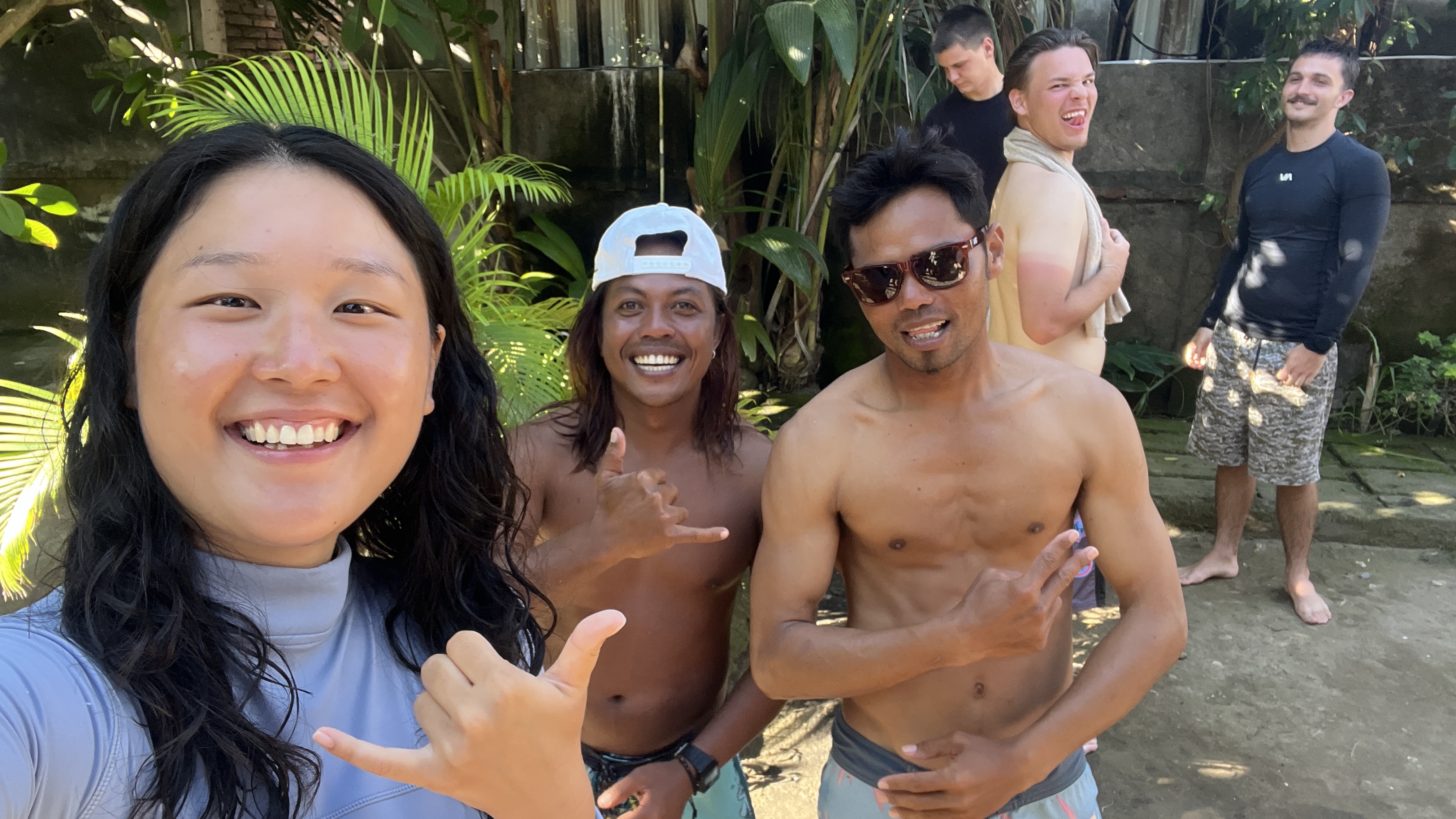 Friends laughing together after surfing
