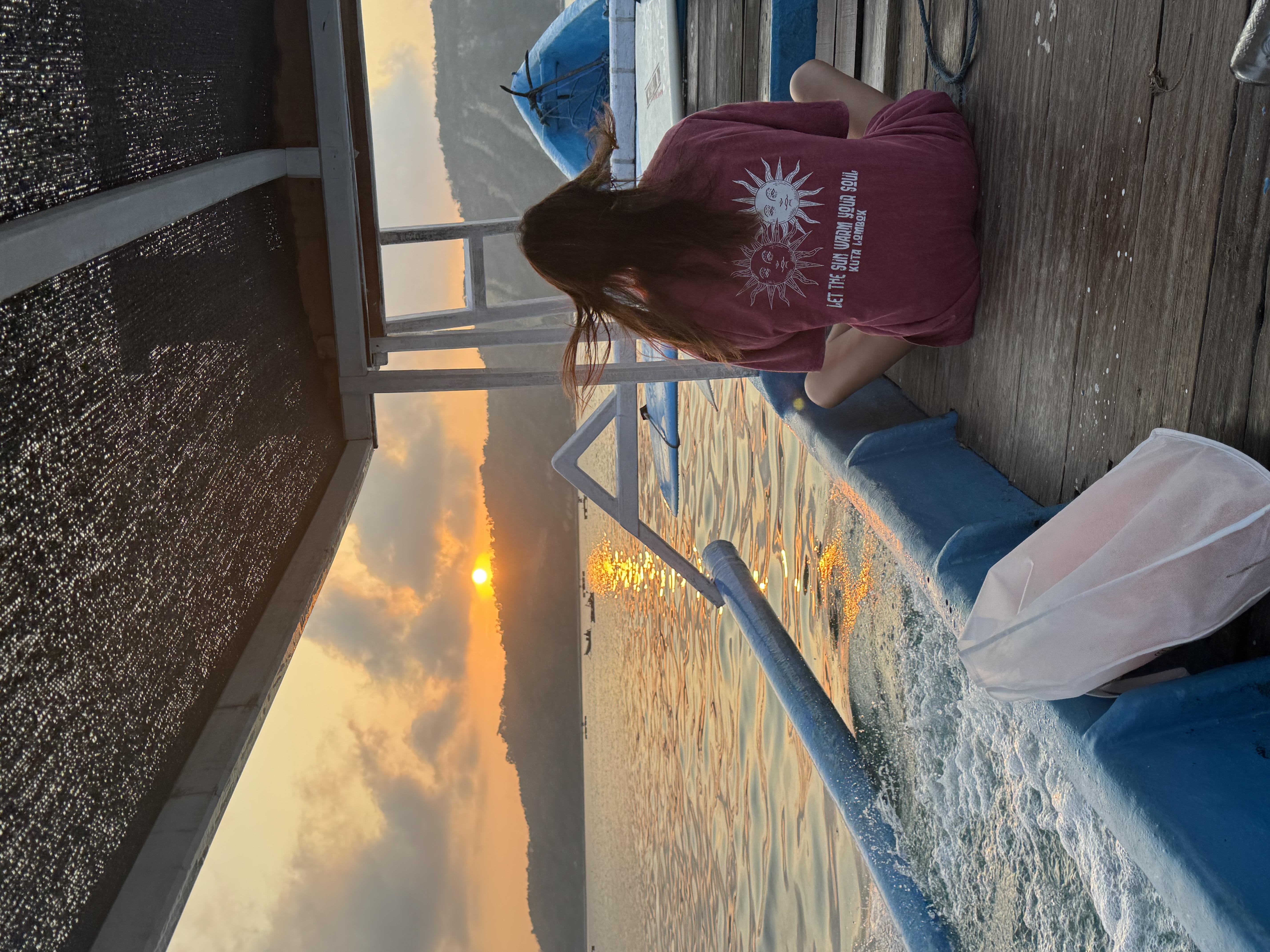 A guest watching the sunset from the boat
