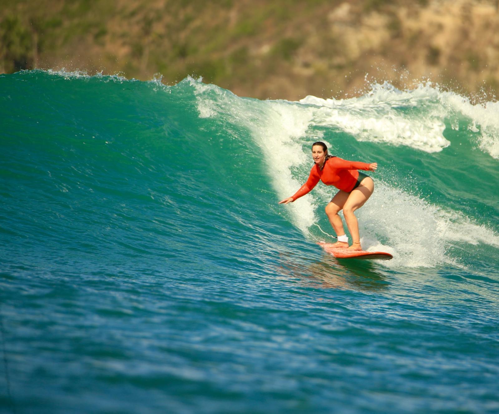Hilary surfing a wave